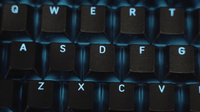 Pushing left across the keyboard in extreme close up.