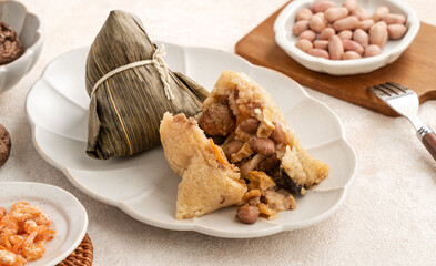 Zongzi, rice dumpling for Dragon Boat Festival on white table background.