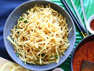 Khao Soi Chicken
Northern Thai curry noodle soup made with tender chicken in a rich coconut milk broth.served with soft egg noodles and topped with crispy noodles. Aromatic, creamy, mildly spicy.