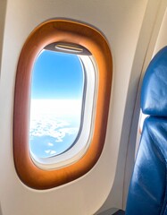 Naklejka premium Airplane Window View of Blue Sky and White Clouds During Daytime Flight