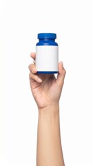 Hand Holding Blue Medicine Bottle With Blank White Label Isolated