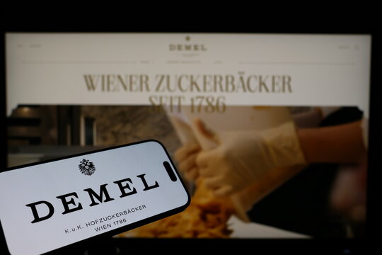 Kiel, Germany - 02-04-2026: Smartphone displaying Austrian confectionery company Demel logo in front of companys webpage