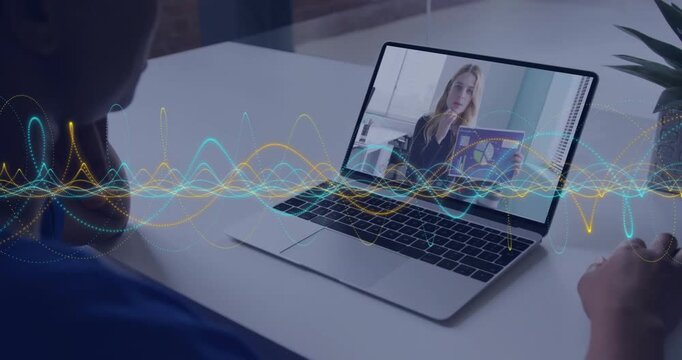 Host holding and pointing charts in business call, viewer leaning, laptop waveform pulsing