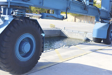 Large Blue Crane Wheel At Dockside Area