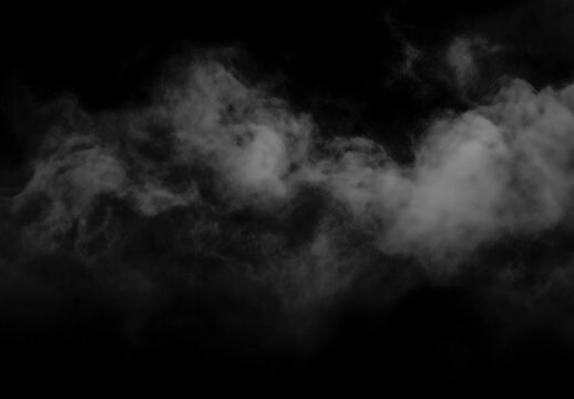 Misty clouds float against dark mysterious foggy background