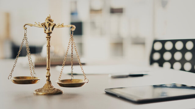The scales of justice on a judge's or lawyer's desk