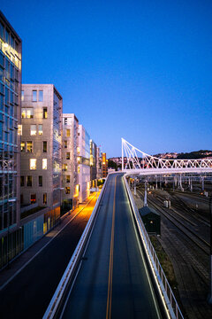 Urban Oslo Barcode night scene where modern architecture frames bridge with vanishing traffic flow in Norway for business mobility concept