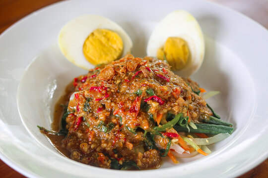Pecel is a traditional salad consisting of various blanched vegetables generously smothered in a thick, savory-sweet peanut sauce.