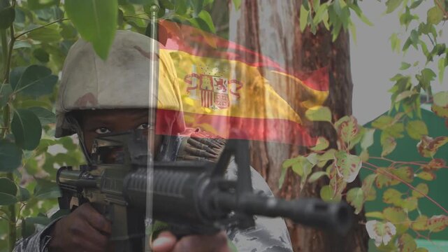 Soldier spotting target and raising rifle from foliage, Spanish flag overlay appearing across frame