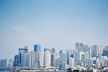 Obraz premium Modern Skylines of an Urban City Against Clear Blue Skies