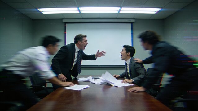 Intense business meeting in a boardroom, suited men argue across a conference table with motion blur, workplace conflict and crisis negotiation mood, corporate leadership stress