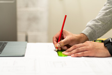 Engineer drawing and blueprint planning at construction site, warehouse and outdoor development. Architecture contractor, project manager or person with floor plan, lines and sketch tools