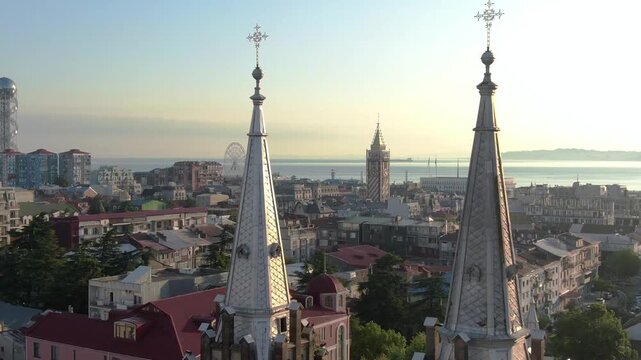 Aerial drone footage of Batumi city, Georgia, showcasing modern architecture, Black Sea coastline, city skyline, streets, and urban development. Cinematic cityscape highlighting .