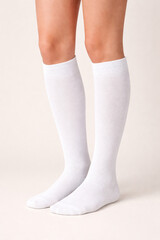 Realistic White Knee-High Socks Mockup on Model Against Neutral Background