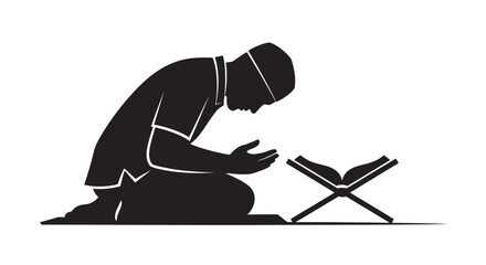 Obraz premium Man Sitting in Prayer with Quran Silhouette