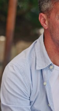 Hands, glasses and wine tasting for couple at picnic, toast or valentines day with partner. Mature person, discussion and smile for with alcohol, beverage or flavor test on holiday for drinks at farm