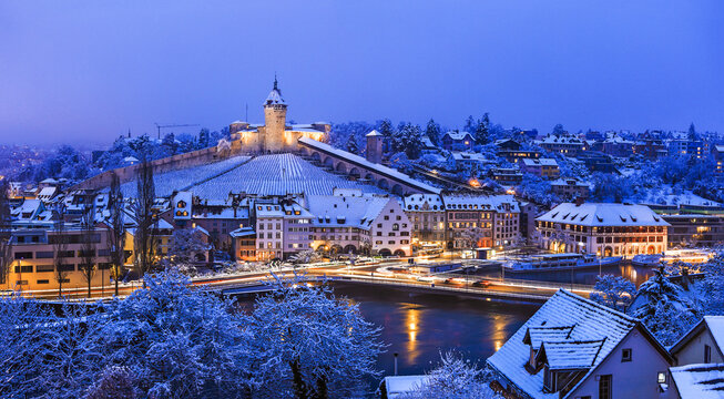 Twilight scene of the medieval fort Munot in Swiss town Schaffhausen with fresh snow in winter