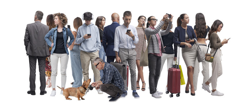 Group of people standing close together. Men and women of different ages wearing casual and business clothing.