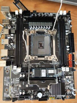 Motherboard with CPU socket and RAM slots on desktop computer hardware