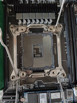CPU Socket Installed on Motherboard with Heatsink and Cooling Fans Nearby
