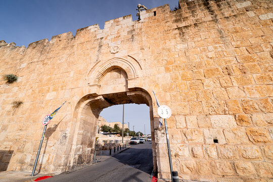 Entrance gate to Old City of Jerusalem, Israeli services in front Western Wall, police cars in the Israeli city.