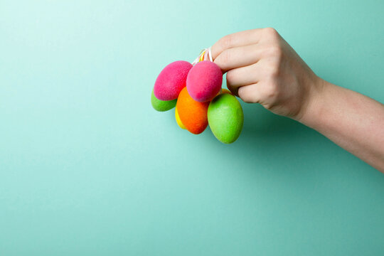 hand holding colorful easter eggs. Easter eggs. People. Decor. Photo. Background. Celebration. 
