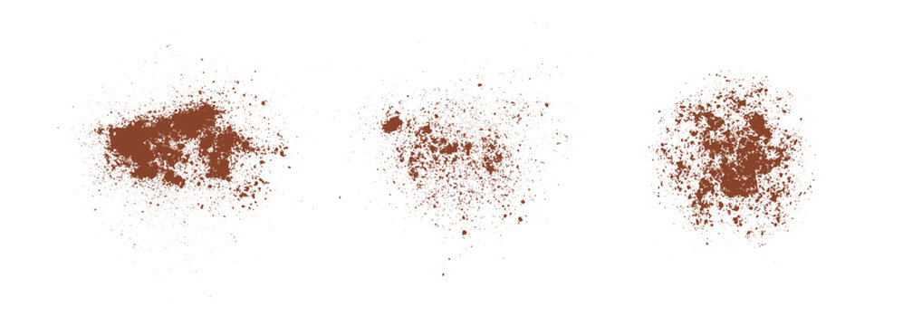Cinnamon powder splatter on isolated white background. Powder dust particles with coffee and cocoa grains. Chocolate powder splatter