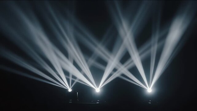 stage lighting three spotlights create beams on dark theater with haze