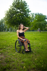 Woman in Wheelchair Enjoying Green Park Landscape