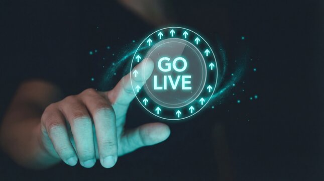 Hand pressing go live button on futuristic interface with glowing arrows