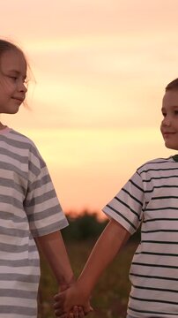 mother father children boy girl park sunset, man woman toddlers outdoors, Sure Here are 10 options for image titles in English, separated by commas: