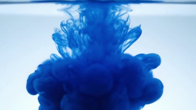 Abstract Liquid Tendrils Macro view of ink diffusing into a liquid, forming delicate, organic tendrils and filaments that drift and transform against a pristine, out-of-focus background.