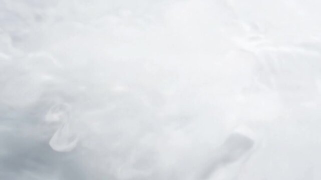 Close-Up Hypnotic Caustic Patterns on Fluid A macro shot detailing the intricate and mesmerizing caustic patterns as they undulate over and within the flowing, high key white ink, highlighting the