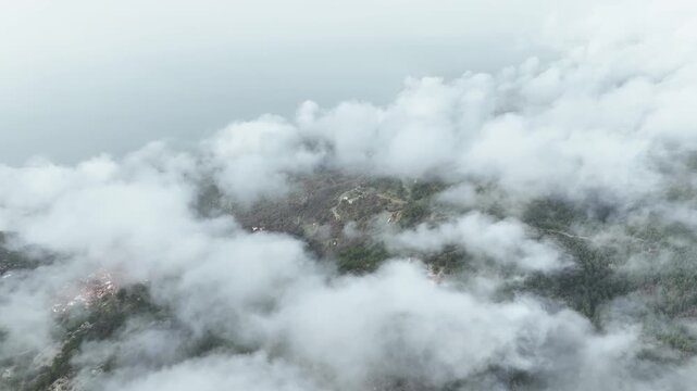 Flying over the landscape with scattered clouds