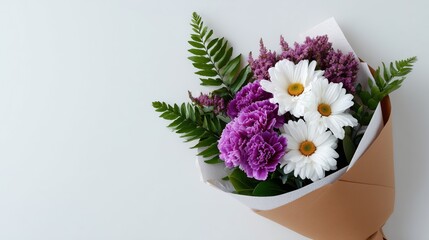 Naklejka premium Flower bouquet wrapped in paper on white background, elegant floral gift concept for Valentine’s Day, Women’s Day, Mother’s Day, greeting cards, and banners with copy space
