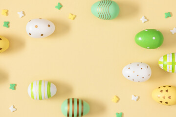Easter Eggs Background. A collection of decorative Easter eggs in pastel colors with a pattern on a plain yellow background. Symbolizes the joy, hope, and renewal of life that come with spring.