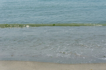 Sand and sea with waves on the beach