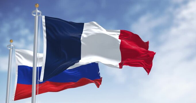 Flags of France and Russia waving together on a clear day