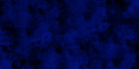 
Artificial magic smoke in black and blue light on black background in darkness. light blue and dark blue background. Black and blue Grunge Concrete Wall Texture Background.

