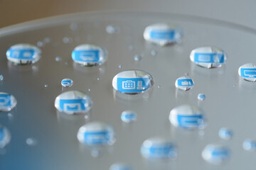 Water Droplets on a Glass Surface with Blue Reflections
