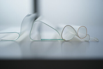 Broken glasses on a table with a blurred background scene