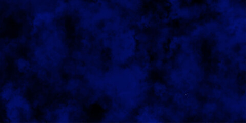 
Artificial magic smoke in black and blue light on black background in darkness. light blue and dark blue background. Black and blue Grunge Concrete Wall Texture Background.

