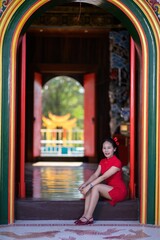 Girl in Red Dress Celebrating New Year in Colorful Archway