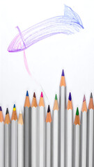 Upward Colored pencils arranged like buildings, with an illustrated upward-pointing kite