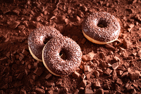 Dark chocolate donuts made of chocolate and springles.