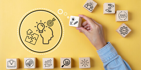 Business Growth Strategy and Goal Planning Concept With hands holding a wooden block that has icons teamwork strategy