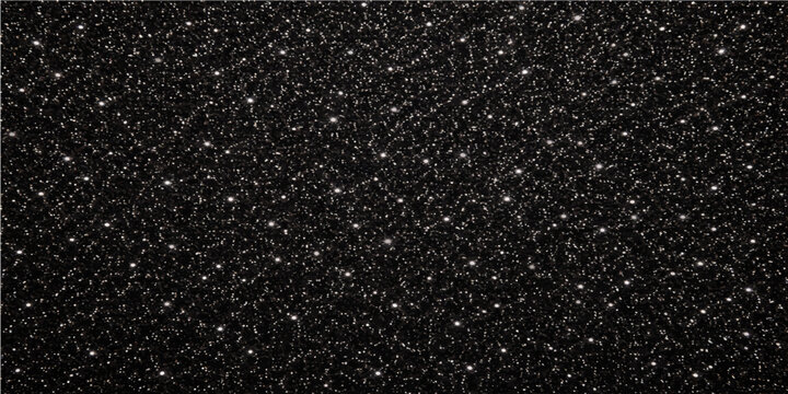 A dark abstract pattern of rain drops on a rough grey asphalt street texture with closeup bitumen material and stone surface backgrounds