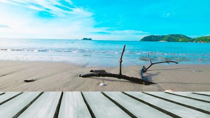 Wooden deck on tropical beach with ocean view, summer vacation background.