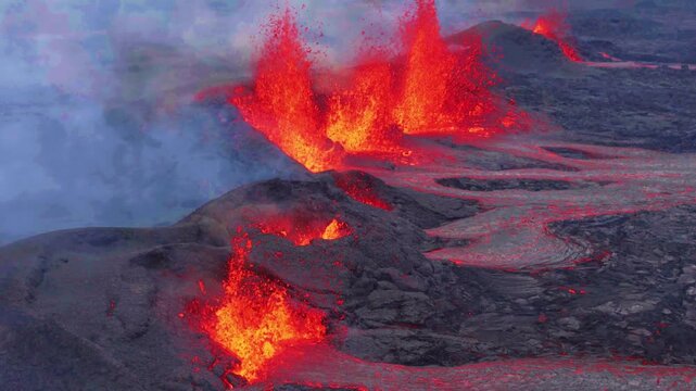 Aerial close-up of active volcano eruption with lava ountains in Iceland