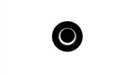 A dark circle with a bright ring around a central hole, all against a white backdrop